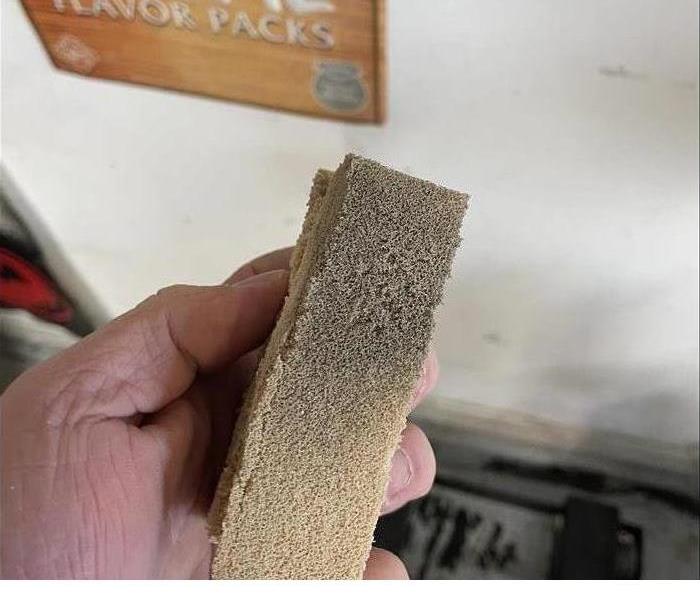 a dry sponge indicating the presence of soot 